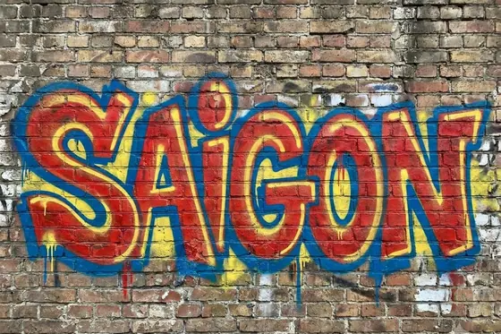 Graffiti — The word "SAIGON" in bold street art letters on a brick wall., kết quả Gemini.
